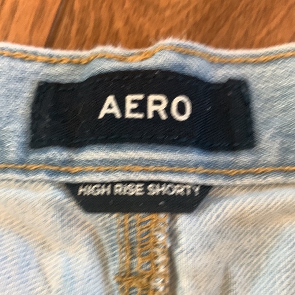 AERO High Rise Shorty Light Wash Distressed Raw Edge Frayed Denim Shorts - Picture 4 of 6